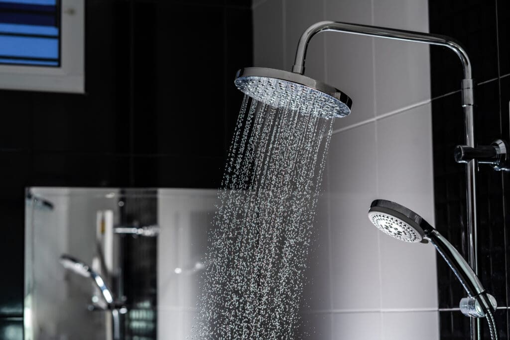 Close up of Water flowing from shower in the bathroom