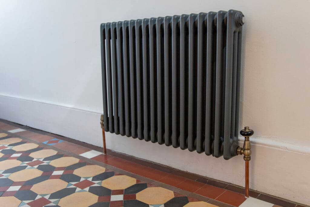 House entrance hall with period feature victorian tiles and radiator