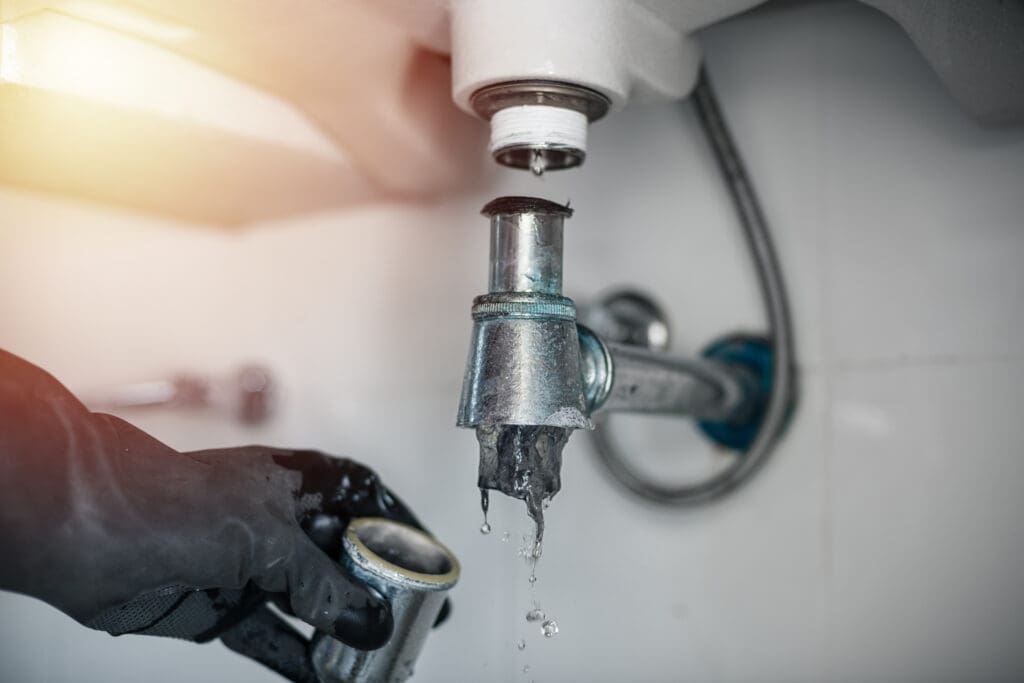 Repairing clogged and leaky washbasin sewer in the bathroom